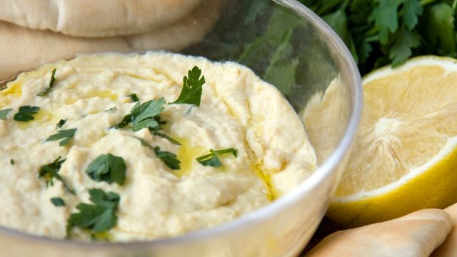 Bowl of hummus with parsley
