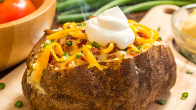 baked potato with sour cream and cheese