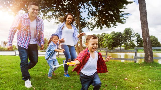 Happy family running outdoors