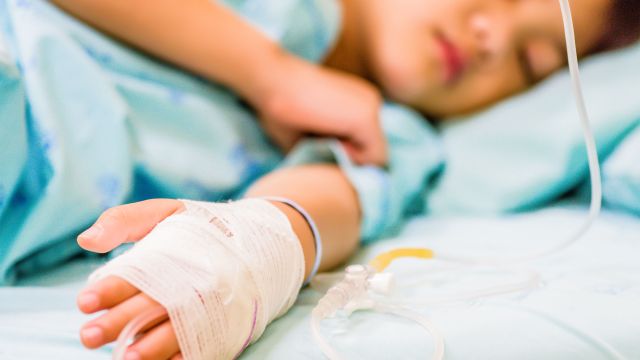 Child patient in hospital bed