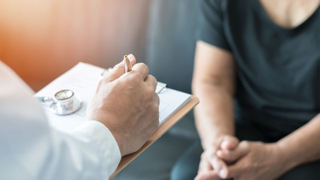 Female patient speaking with doctor