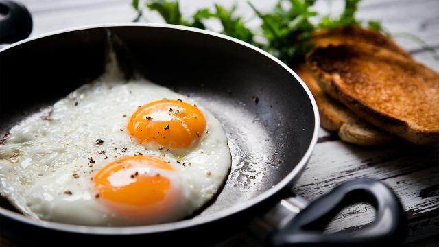 Eggs cooking in a frying pan