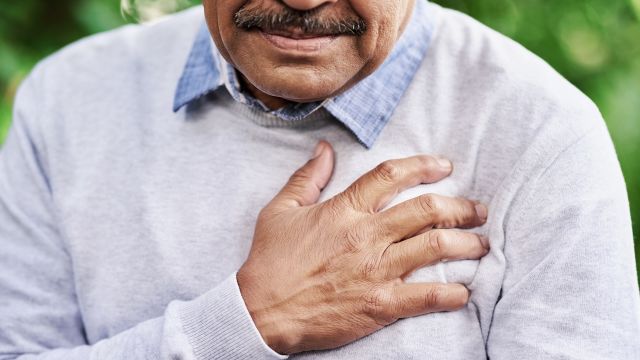 man holding his chest