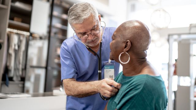 nurse listening to heart