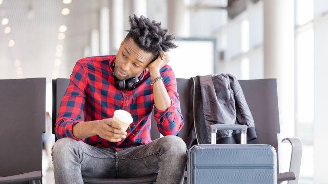 man waiting at airport