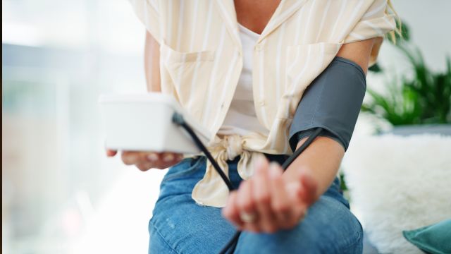 woman checking blood pressure