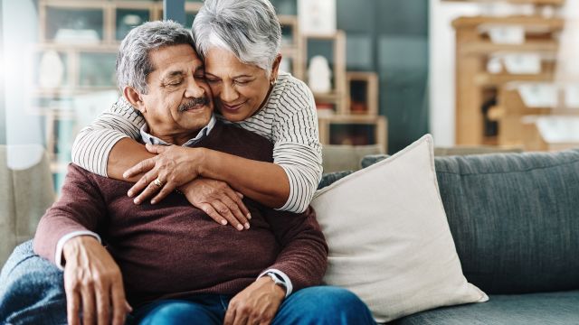 elderly couple embracing