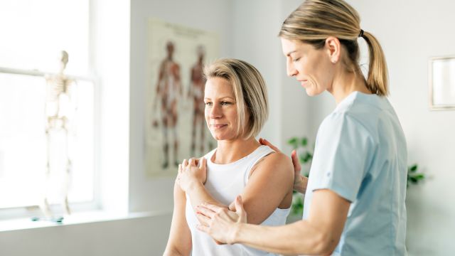 doctor checking patient's reflexes