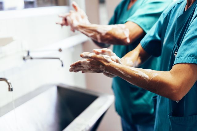 Healthcare workers washing their hands