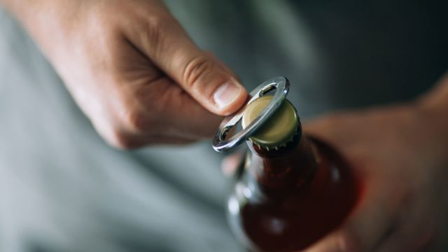 opening a beer bottle