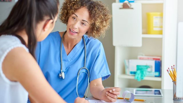 nurse talking to patient