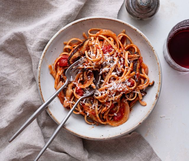 Picture of linguine with mushroom bacon, onion and tomato