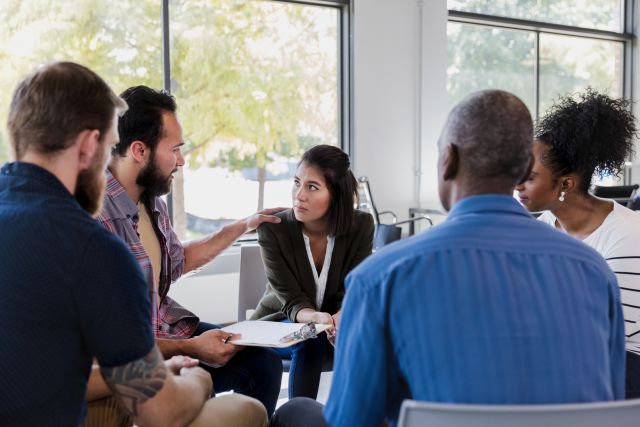 People recovering from substance use disorders participate in a support group.