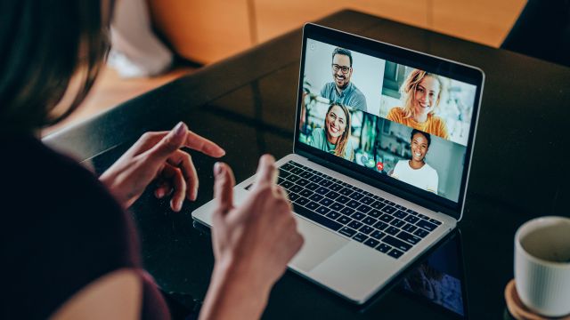 A woman participates in an online support group for people with inflammatory bowel disease.