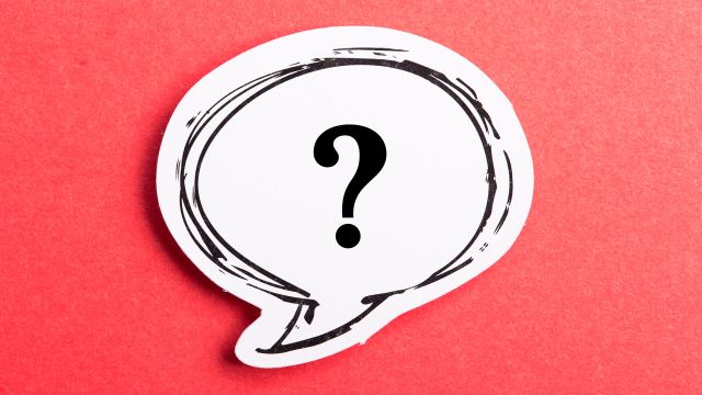 A question mark inside a speech bubble on a red background. The cause of chronic hives are unknown in many cases.