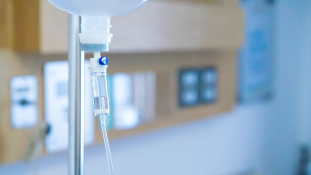 Closeup of an IV drip in a hospital room. 