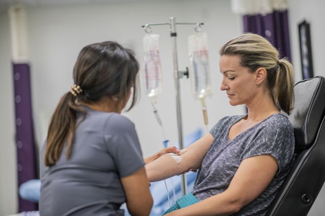 During an iron infusion, a fluid solution containing iron is administered by intravenous (IV) infusion.