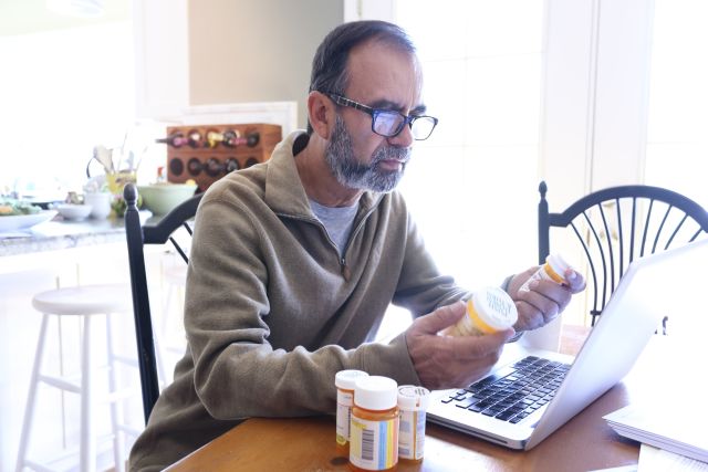 man reviewing his medications and healthcare plan