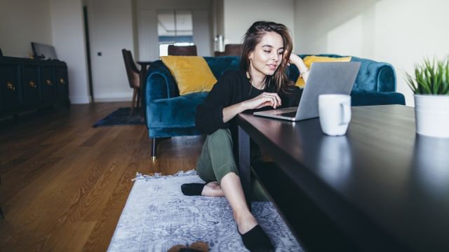 A young woman talks with friends with a video call. Connecting with peers who also have the same skin condition you have can be a valuable source of information and support.