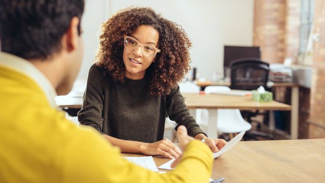 A young woman talks to her manager about a lupus diagnosis.