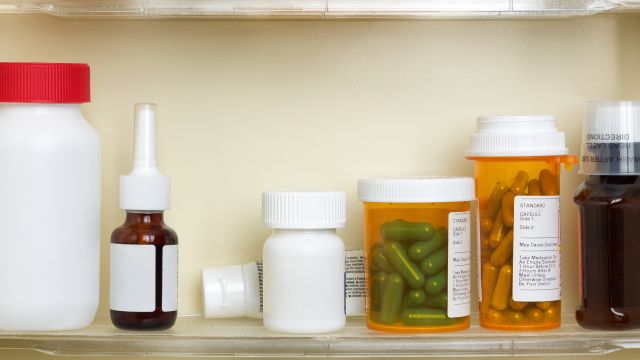 A medicine cabinet containing a variety of prescription drugs.