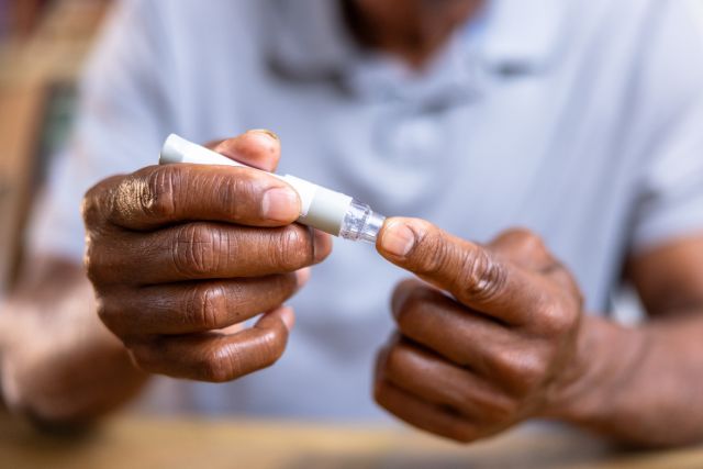 An older man tests his blood sugar. Diabetes control is an important element of a treatment plan for diabetic macular edema.