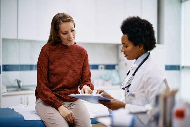 woman patient seeing woman provider in office