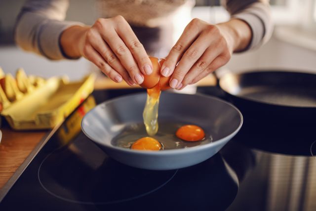 cooking eggs in a pan