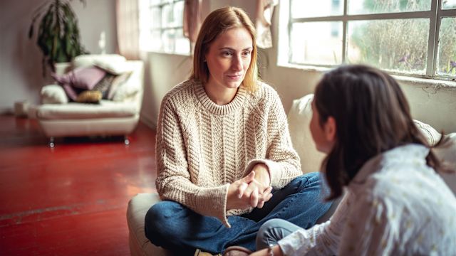 Woman talking with daughter