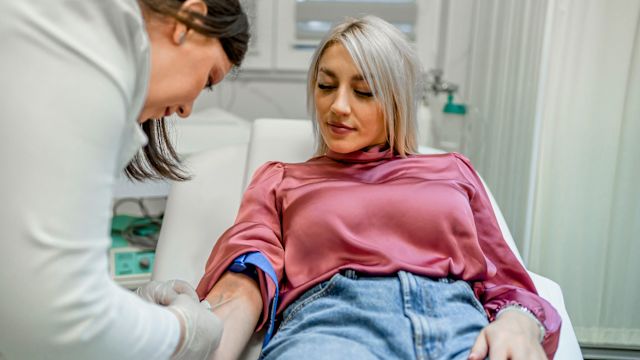 A woman has her blood drawn at a healthcare appointment. Blood tests can be used to estimate glomerular filtration rate.