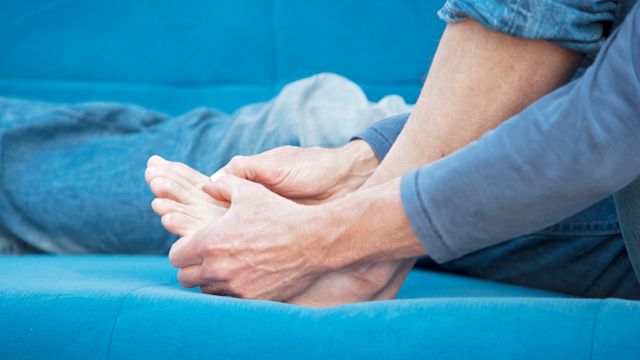 A man experiencing gout pain in his foot