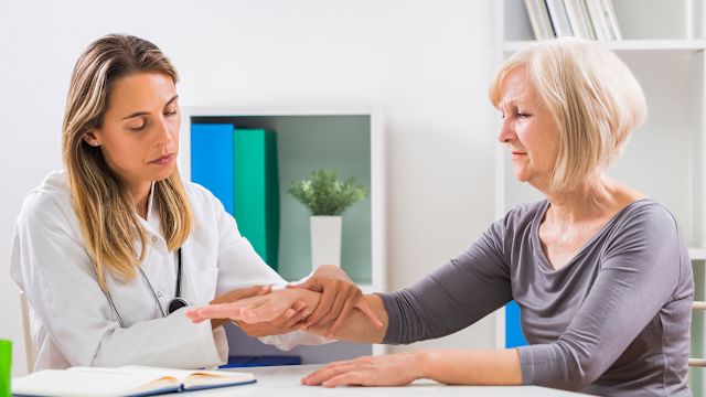Doctor examining patient's wrist