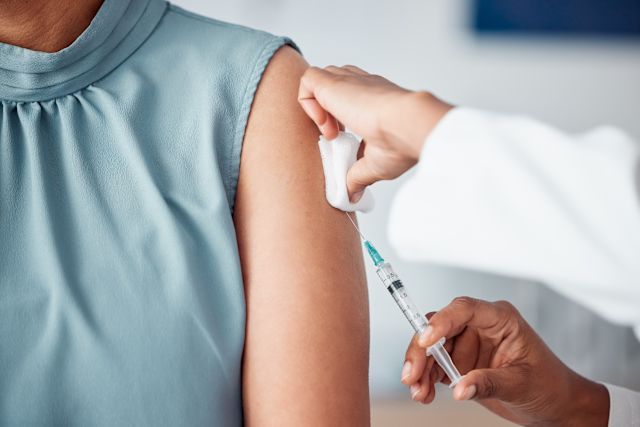 mature woman receiving shingles vaccine