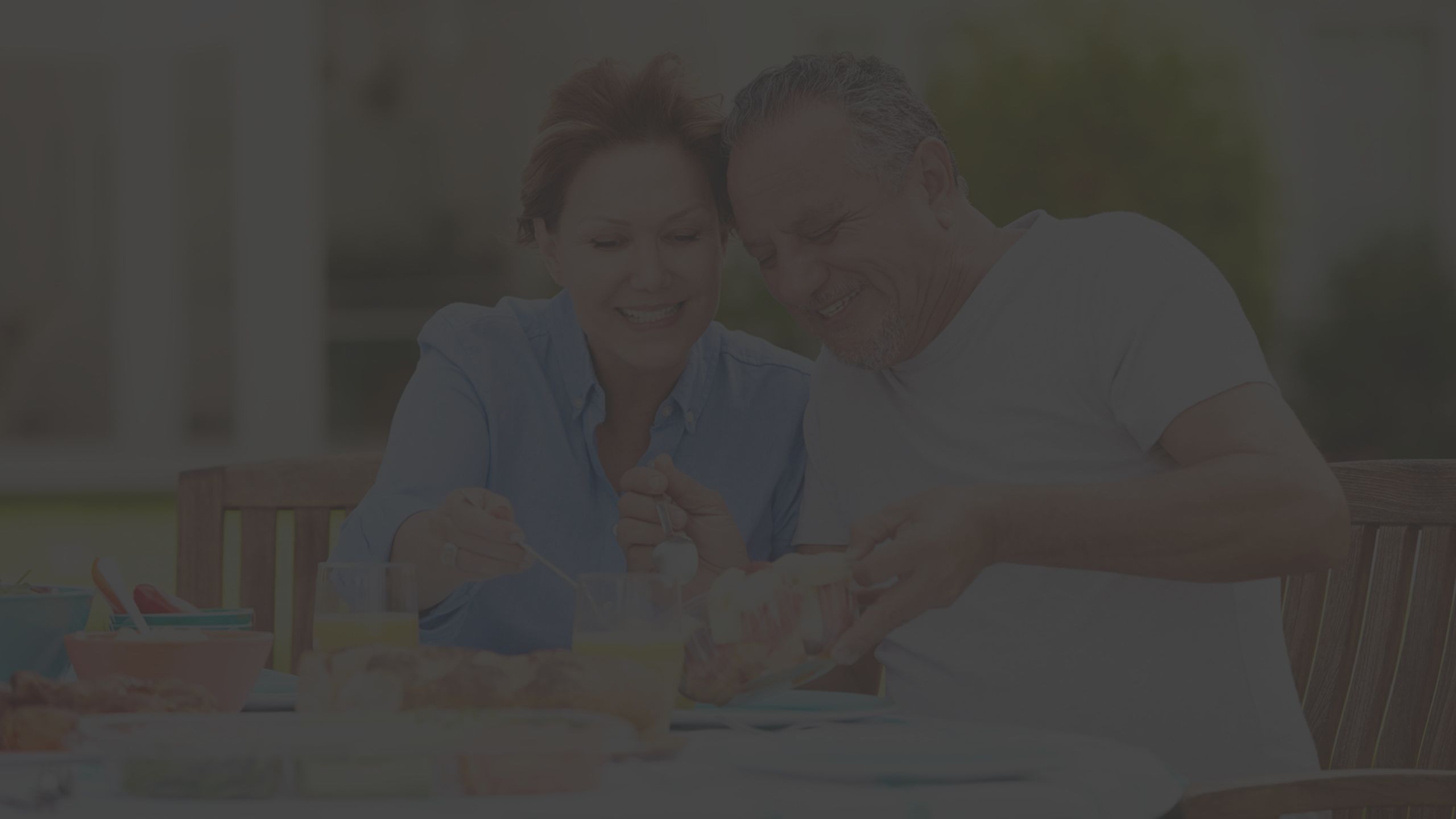 two people eating food, dining outside