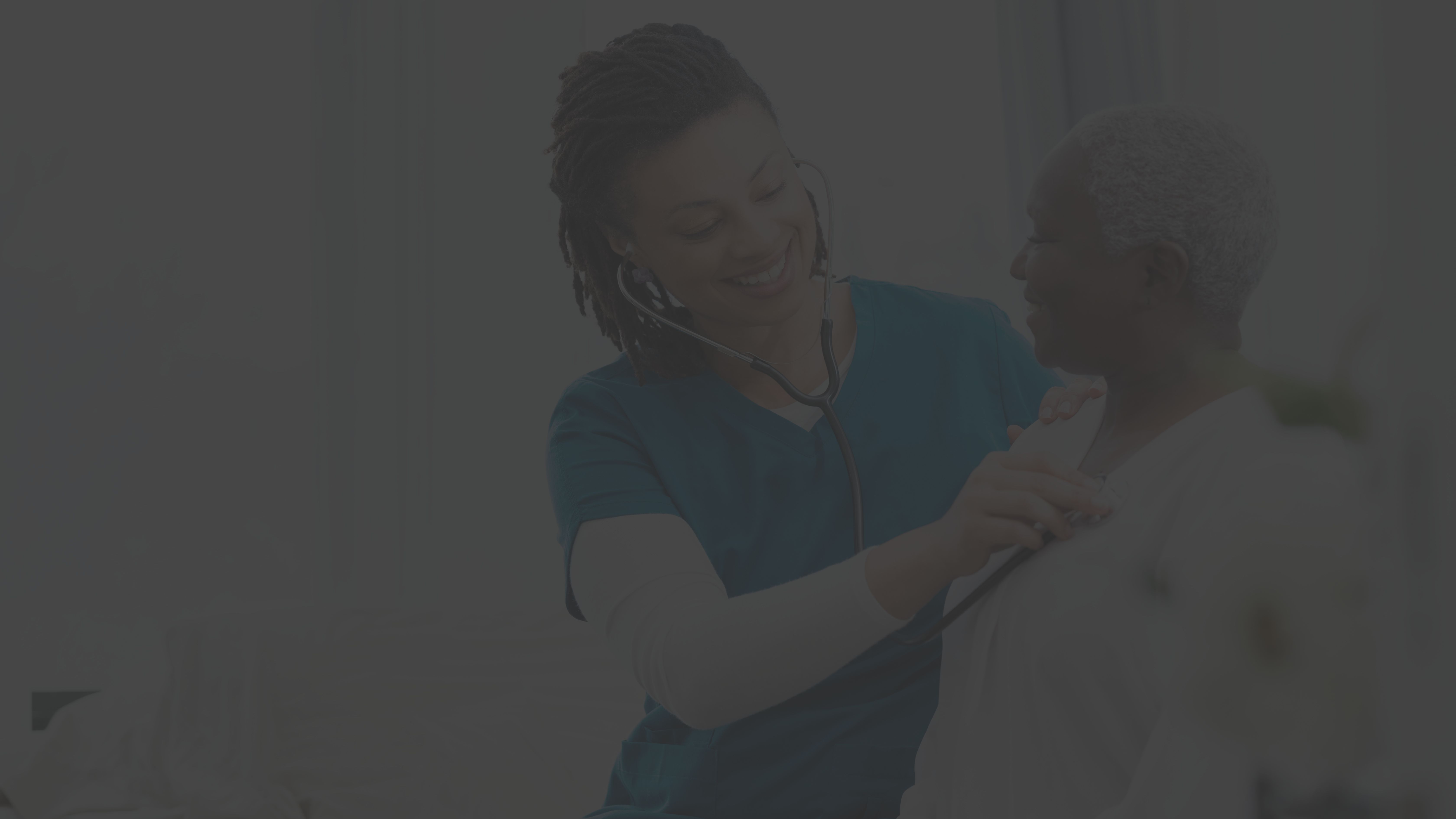 Nurse examining patient's lungs