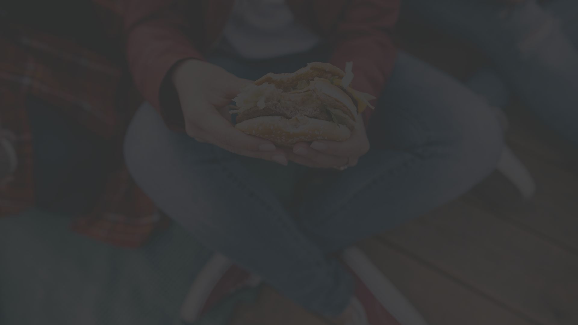 man eating a cheeseburger