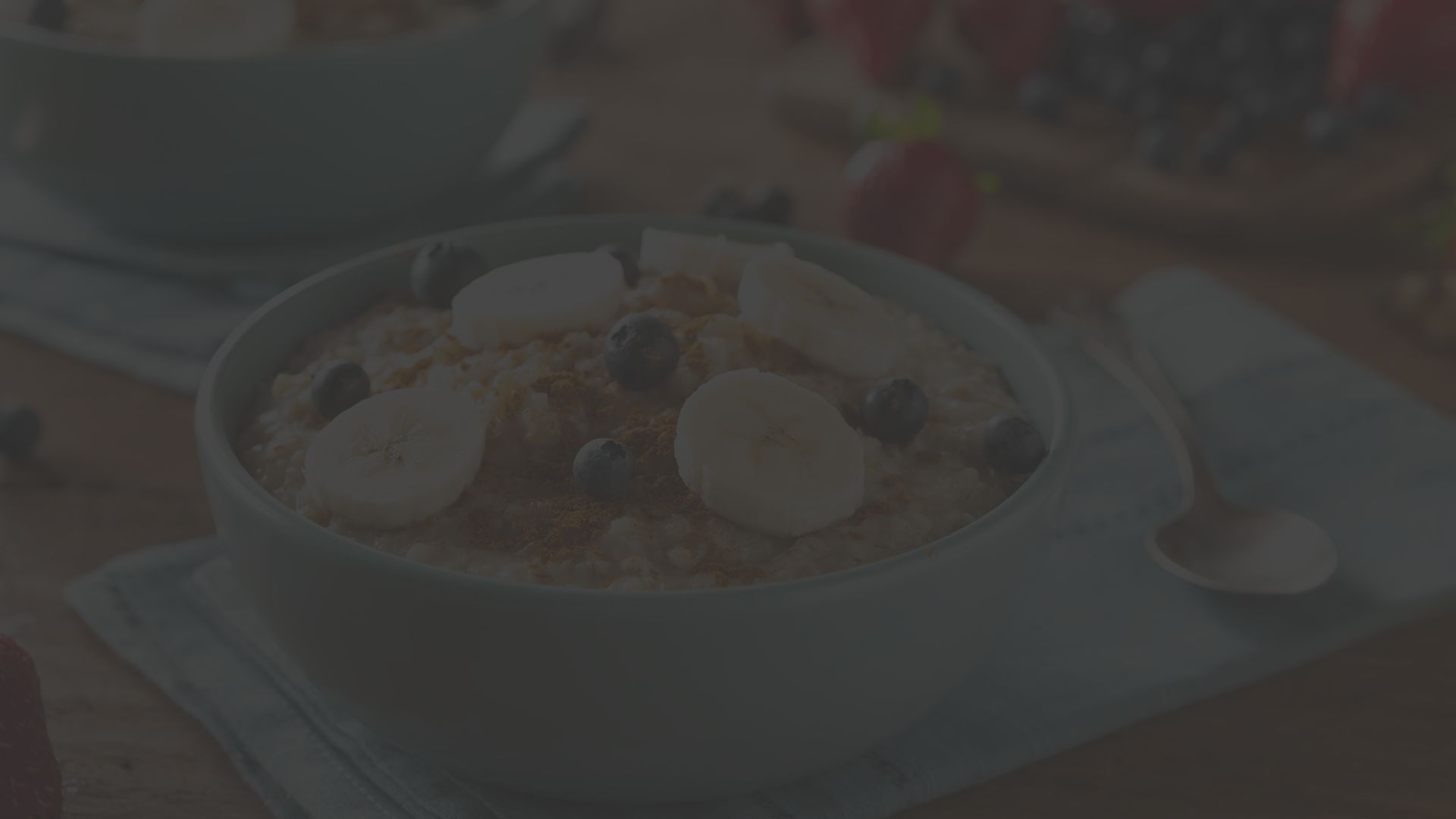 Oatmeal and fruit n a light blue bowl