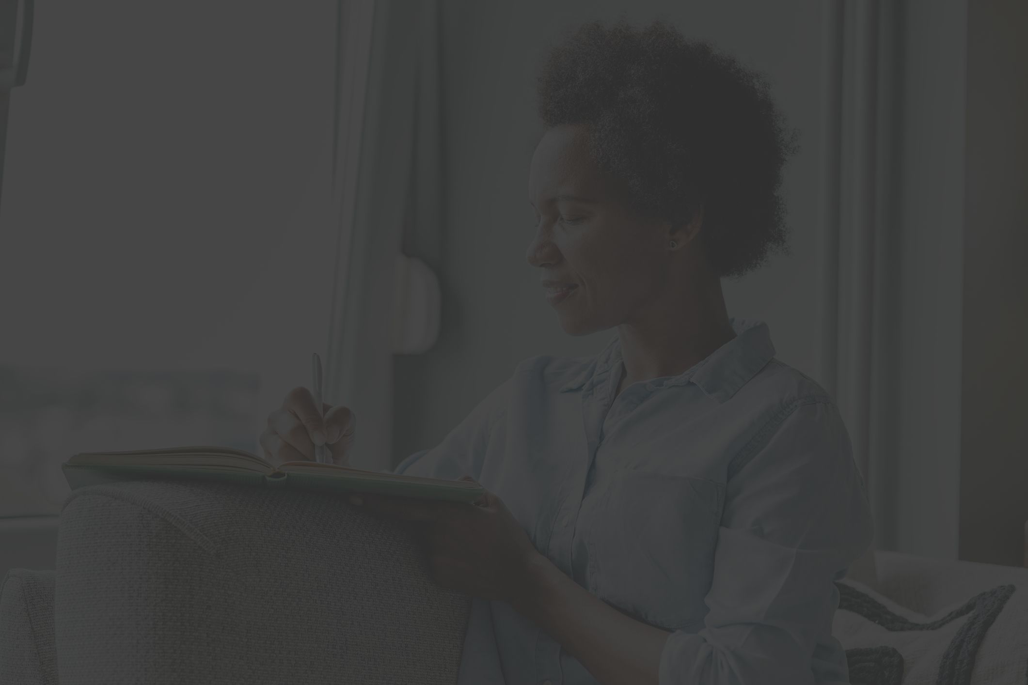 woman writing in journal