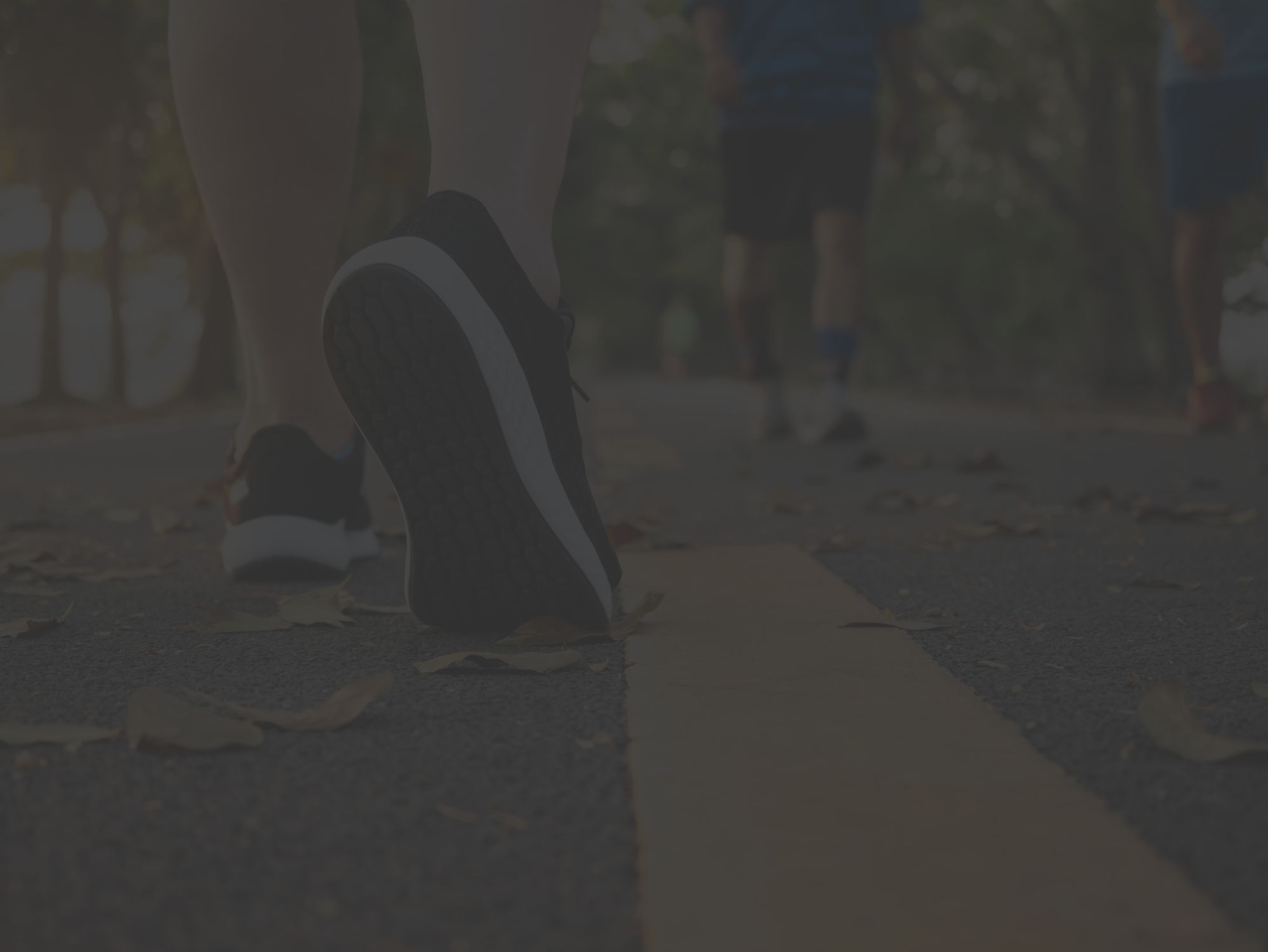 close-up of sneakers walking on pavement