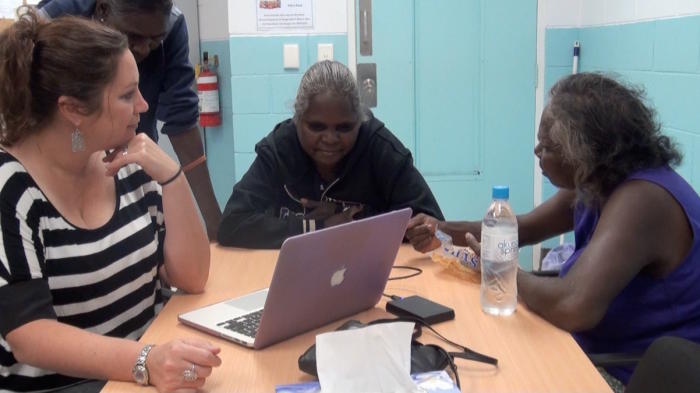 Associate Professor Rachel Nordlinger with Joan Nummar’s daughters listening to their late father John speaking Marri Ngarr, recorded in June 1992. Picture: Dr Ian Green.