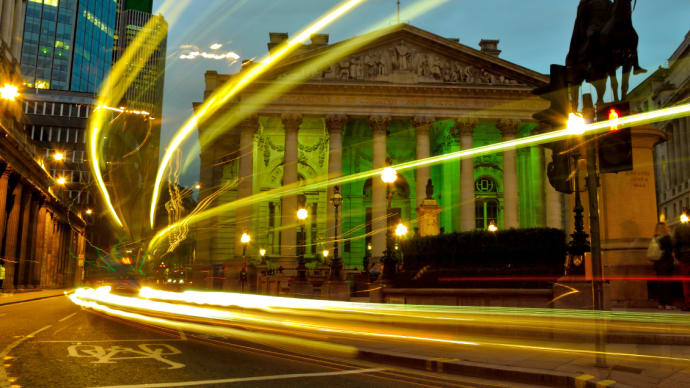 car lights moving fast past bank - blog image